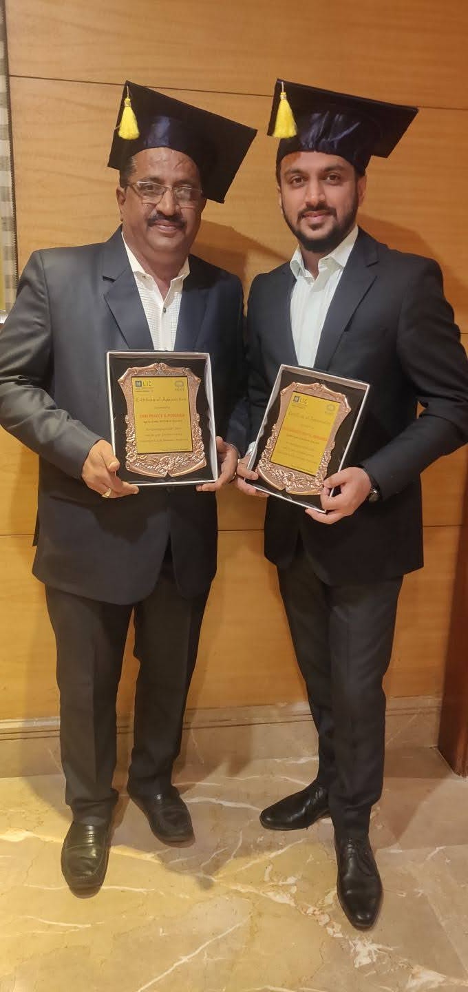 Praful and Darshit Morjaria with LIC MDRT certificates of appreciation