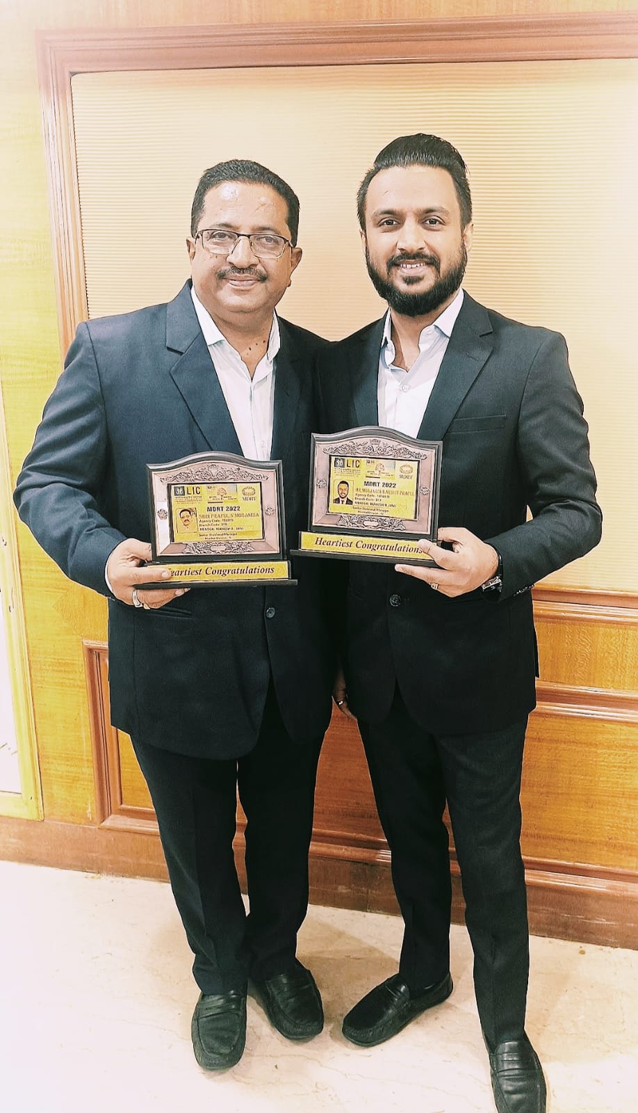 Praful and Darshit Morjaria holding LIC MDRT award plaques